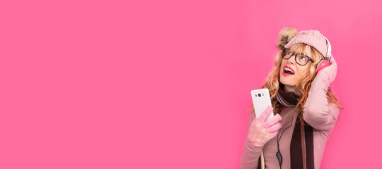 woman with headphones and mobile phone isolated on background