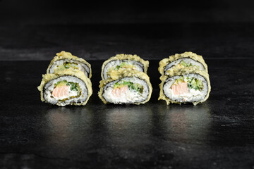 Sushi Rolls. Sushi Rolls Set, maki, philadelphia and california rolls, on a Black background.