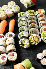 Sushi Rolls. Sushi Rolls Set, maki, philadelphia and california rolls, on a Black background.