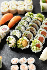 Sushi Rolls. Sushi Rolls Set, maki, philadelphia and california rolls, on a Black background.