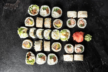Sushi Rolls. Sushi Rolls Set, maki, philadelphia and california rolls, on a Black background.