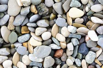 Background and texture of pebbles lying next to each other