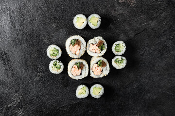 Sushi Rolls. Sushi Rolls Set, maki, philadelphia and california rolls, on a Black background.