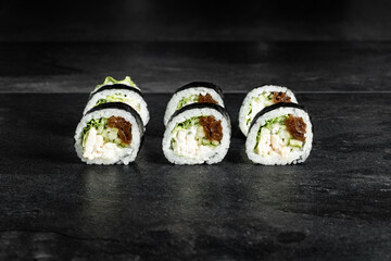Sushi Rolls. Sushi Rolls Set, maki, philadelphia and california rolls, on a Black background.