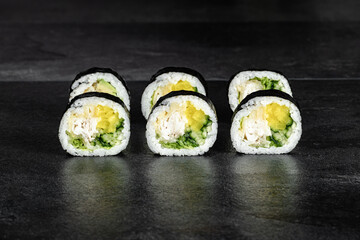 Sushi Rolls. Sushi Rolls Set, maki, philadelphia and california rolls, on a Black background.