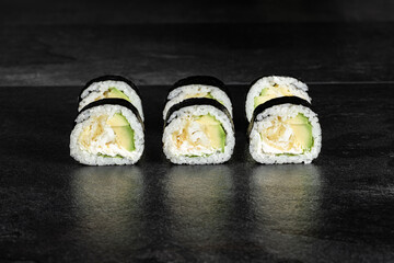 Sushi Rolls. Sushi Rolls Set, maki, philadelphia and california rolls, on a Black background.