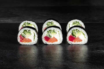 Sushi Rolls. Sushi Rolls Set, maki, philadelphia and california rolls, on a Black background.