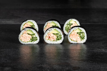 Sushi Rolls. Sushi Rolls Set, maki, philadelphia and california rolls, on a Black background.