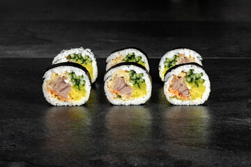 Sushi Rolls. Sushi Rolls Set, maki, philadelphia and california rolls, on a Black background.