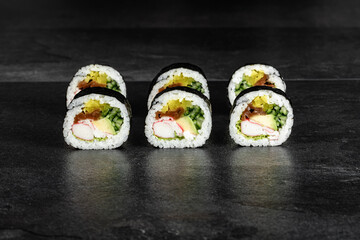Sushi Rolls. Sushi Rolls Set, maki, philadelphia and california rolls, on a Black background.