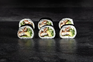 Sushi Rolls. Sushi Rolls Set, maki, philadelphia and california rolls, on a Black background.