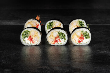 Sushi Rolls. Sushi Rolls Set, maki, philadelphia and california rolls, on a Black background.