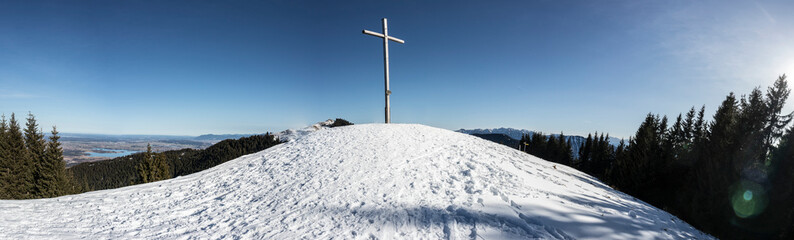 Fototapeta na wymiar Panorama summit cross of Hoernle mountain in Bavaria, Germany