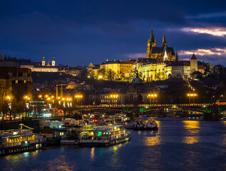 Stunning view of Prague at dusk, with castle and cathedral in the background