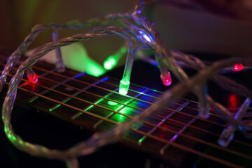 Garland light bulbs in dark on guitar strings
