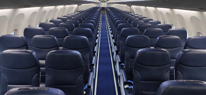 Empty passenger seats in the aircraft cabin.