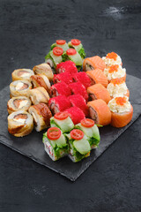 Big set of rolls with shrimp, salmon, eel, tuna and flying fish roe