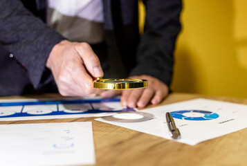Analysing of accounting and financial documents, diagrams with magnifier. economy research