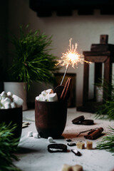 Cocoa with marshmallows in a glass on a New Year's table