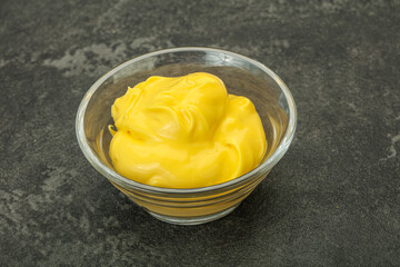 Natural cheese sauce in the bowl