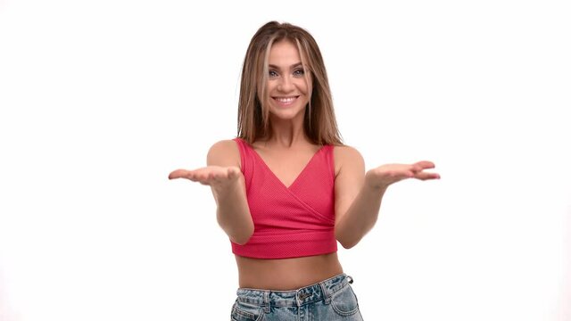 Cheerful young woman gesticulating coming here or inviting joining to her. 4k Dragon RED camera
