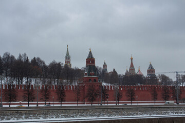 Obraz premium The Red Square. Red brick wall wall. Moscow. Church domes. Kremlin. The Spasskaya Tower.