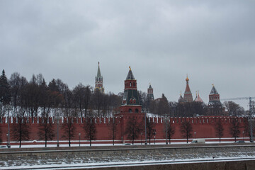 Obraz premium The Red Square. Red brick wall wall. Moscow. Church domes. Kremlin. The Spasskaya Tower.