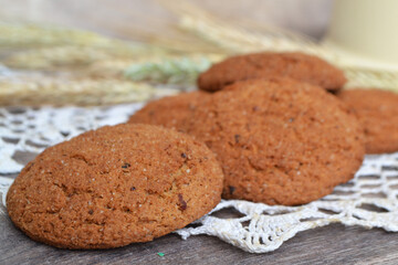 Homemade oatmeal cookies on rustic background close up