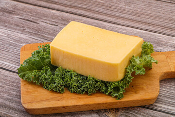 Tasty yelloow Tilsiter cheese brick