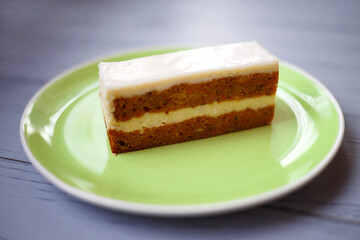 slice of carrot ginger pie on a green plate on a wooden background