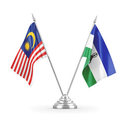 Lesotho and Malaysia table flags isolated on white 3D rendering