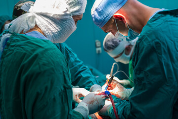 Team of surgeons performing surgery in hospital