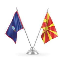 North Macedonia and Guam table flags isolated on white 3D rendering