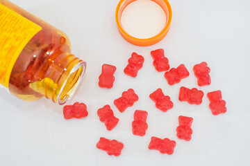vitamins for children, such as jelly candies on a white