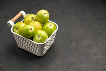 front view green tomatoes inside basket on dark background fresh photo ripe color food free place
