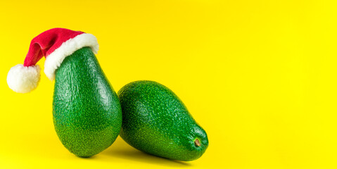 fresh two avoado on yellow background