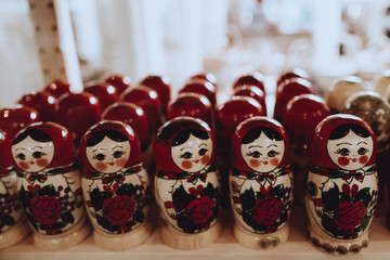 Blurred Russian traditional dolls Matryoshka in a row in a shop window
