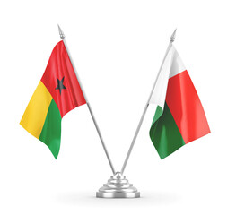 Madagascar and Guinea-Bissau table flags isolated on white 3D rendering