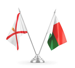 Madagascar and Jersey table flags isolated on white 3D rendering