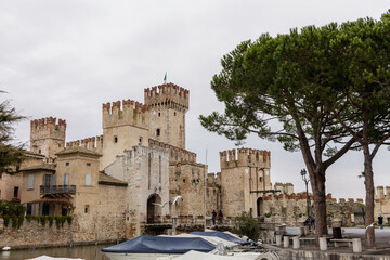 Fototapeta premium The Scaligero castle of Sirmione is a fortress from the Scaligera era, the access point to the historic center of Sirmione. It is one of the most complete and best preserved castles in Italy.