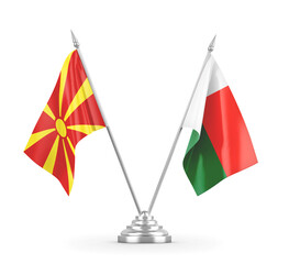 Madagascar and North Macedonia table flags isolated on white 3D rendering