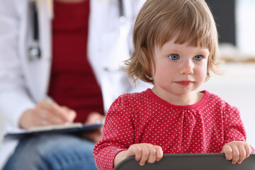 Little child with mother at pediatrician reception. Physical exam, cute infant portrait, baby aid, healthy lifestyle, ward round, child sickness, clinic test, high quality and trust concept