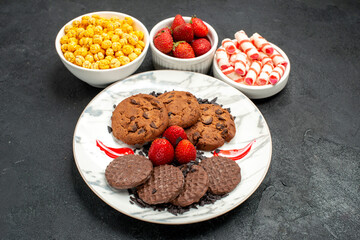 top view delicious choco biscuits with candies on dark background sweet cookies cake