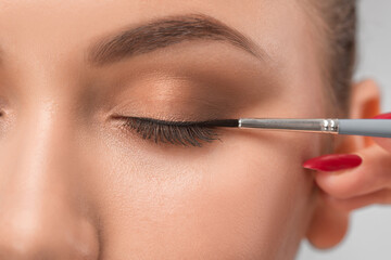 Eyes and eyebrows close up. Portrait of a beautiful teenage girl with beautiful makeup and healthy clean skin. Make-up artist does eyes make-up.Makeup concept.