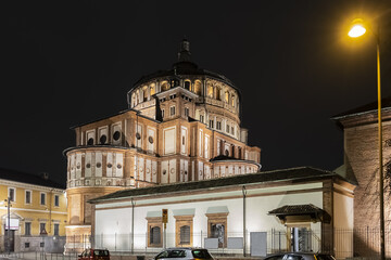 Fototapeta na wymiar Night view of Saint Maria Grazie Church (Basilica di Santa Marie delle Grazie, XV century) - Renaissance style, listed as World Heritage by UNESCO. Milan, Lombardy, Italy.