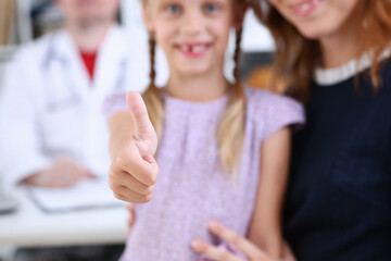 Smiling little child medicine and doctor showing OK sign with thumb up at office portrait. High level work, confident satisfied like, visit to clinic, best occupation, emergency help, teamwork concept