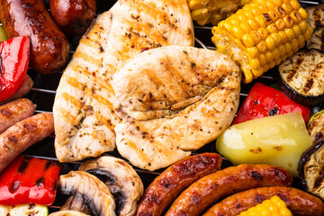 Grilled sausages, meat, and vegetables.