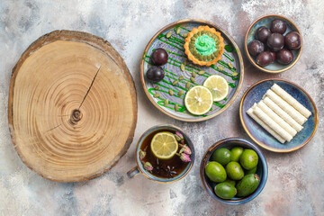 top view little creamy cake with fruits on light desk photo biscuit candy sweet