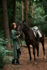 Gourmet lady in a vintage dress. A beautiful rider gently hugs the horse. Artistic Photography
