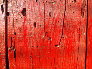 Texture of used wood planks painted red